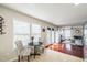 Bright breakfast nook with ample natural light and views of the living area's fireplace at 6 Newgate Ct, Durham, NC 27713