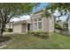 Charming home featuring a blue front door, attached garage, well-maintained lawn and beautiful front yard landscaping at 6 Newgate Ct, Durham, NC 27713