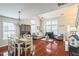 Open floor plan with gleaming hardwood floors, lots of natural light, and neutral colors throughout the space at 6 Newgate Ct, Durham, NC 27713