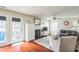 Cozy living room with a fireplace, hardwood floors, lots of natural light and comfortable seating at 6 Newgate Ct, Durham, NC 27713