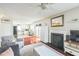 Open living space with a cozy fireplace and a view into the well-equipped kitchen and breakfast nook at 6 Newgate Ct, Durham, NC 27713