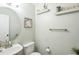 Stylish half-bathroom featuring a modern sink, decorative mirror and a well-chosen light fixture at 6 Newgate Ct, Durham, NC 27713