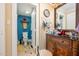 Well-lit bathroom boasts blue accent wall, a toilet and a vanity with storage and a decorative mirror at 6035 Sentinel Dr, Raleigh, NC 27609