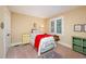 Comfortable bedroom featuring a twin bed, a colorful coverlet, and a decorative rug at 6035 Sentinel Dr, Raleigh, NC 27609