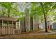 Charming home featuring a screened porch, gray wood siding, and a beautifully landscaped yard at 6035 Sentinel Dr, Raleigh, NC 27609