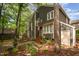 Two-story home with charming curb appeal, featuring brick steps, beautiful landscaping, and an American flag at 6035 Sentinel Dr, Raleigh, NC 27609