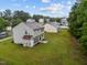 Back exterior featuring a large green backyard, perfect for outdoor activities at 612 Quartz Dr, Durham, NC 27703
