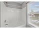 Bright bathroom with a white shower and natural light from the window at 612 Quartz Dr, Durham, NC 27703
