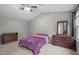 Spacious bedroom with ceiling fan and neutral paint at 612 Quartz Dr, Durham, NC 27703