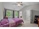 Comfortable bedroom with ample natural light and en-suite bathroom access at 612 Quartz Dr, Durham, NC 27703