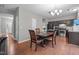 A dining area with a round table and chairs, adjacent to the kitchen at 612 Quartz Dr, Durham, NC 27703