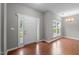 Inviting foyer featuring hardwood floors, a bright window, and a white front door at 612 Quartz Dr, Durham, NC 27703