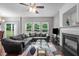Spacious living room featuring a fireplace, ample windows, and stylish decor at 612 Quartz Dr, Durham, NC 27703
