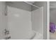 Shower with white tile surround and updated fixtures at 612 Quartz Dr, Durham, NC 27703