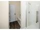 Bright bathroom featuring a glass door shower and wood-look tile flooring at 6737 Vernie Dr, Raleigh, NC 27603