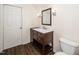 Bathroom featuring a new vanity with a white countertop, mirror, and light fixture at 6737 Vernie Dr, Raleigh, NC 27603