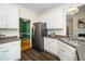 Charming kitchen with stainless steel appliances, white cabinets and durable countertops at 6737 Vernie Dr, Raleigh, NC 27603