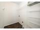 Functional laundry room with shelving units and vinyl flooring at 6737 Vernie Dr, Raleigh, NC 27603