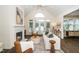 Comfortable living room with a fireplace, french doors, and stylish furniture at 6737 Vernie Dr, Raleigh, NC 27603