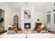 Cozy living room with a fireplace, comfortable seating, and stylish decor at 6737 Vernie Dr, Raleigh, NC 27603