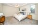 Inviting main bedroom with tray ceiling, plush carpeting, and natural light at 6737 Vernie Dr, Raleigh, NC 27603