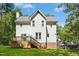 Charming home featuring a spacious backyard with a wooden deck and stair access, perfect for outdoor enjoyment at 6912 Baywood Dr, Raleigh, NC 27613
