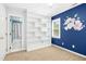 Bedroom with built-in bookshelves and an ensuite bathroom with a view at 6912 Baywood Dr, Raleigh, NC 27613
