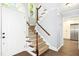 Well-lit foyer and staircase leading to the upper level of the home at 6912 Baywood Dr, Raleigh, NC 27613
