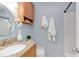 Bright bathroom featuring a granite countertop, wooden cabinets, and a decorative vase with flowers at 7 Hitching Rack Ct, Durham, NC 27713