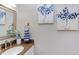Bathroom sink with white vanity, granite countertop, floral decoration, and art on the wall at 7 Hitching Rack Ct, Durham, NC 27713