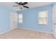 Light and airy bedroom with neutral carpet, a ceiling fan, and two windows that let in natural light at 7 Hitching Rack Ct, Durham, NC 27713