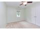 Vacant bedroom with a ceiling fan, a window with blinds, and a closet with doors at 7 Hitching Rack Ct, Durham, NC 27713