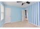 Bedroom featuring blue walls with white trim and doors and neutral carpet flooring at 7 Hitching Rack Ct, Durham, NC 27713
