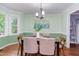 Inviting dining room features chair rail, light fixture, wood floors, and neutral paint at 7 Hitching Rack Ct, Durham, NC 27713