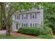 Two-story home with gray siding, mature landscaping and a welcoming front entrance at 7 Hitching Rack Ct, Durham, NC 27713