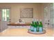 Spacious kitchen featuring granite countertops, white cabinets, and access to the backyard at 7 Hitching Rack Ct, Durham, NC 27713