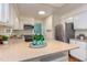 Modern kitchen featuring granite countertops, white cabinets, and stainless steel refrigerator at 7 Hitching Rack Ct, Durham, NC 27713