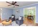 Open living room with hardwood floors, comfortable seating and dining area at 7 Hitching Rack Ct, Durham, NC 27713