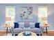 Cozy living room with a comfortable sofa, stylish decor, and plenty of natural light at 7 Hitching Rack Ct, Durham, NC 27713