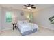 Spacious bedroom featuring large windows and a beautifully decorated queen bed at 7 Hitching Rack Ct, Durham, NC 27713