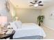 Calm bedroom with a ceiling fan, neutral decor, and a large bed with white bedding at 7 Hitching Rack Ct, Durham, NC 27713
