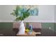 Dining table set with stylish vases, lemons, and colorful dishware on a wooden cutting board at 7 Hitching Rack Ct, Durham, NC 27713