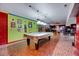 A unique basement offers a full billiard table and space for entertaining at 750 Greenleaf Rd, Angier, NC 27501