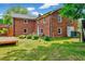 Spacious brick home with a well-maintained lawn and a deck area at 750 Greenleaf Rd, Angier, NC 27501