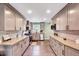 Bright kitchen with stainless steel appliances, modern cabinetry and spacious countertops at 750 Greenleaf Rd, Angier, NC 27501