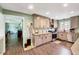 This spacious kitchen features wood floors, modern appliances, and light-colored cabinets at 750 Greenleaf Rd, Angier, NC 27501