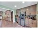 Stylish kitchen with stainless steel appliances, modern cabinetry, and spacious countertops at 750 Greenleaf Rd, Angier, NC 27501