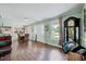 Bright living room featuring hardwood floors and view into kitchen and dining area at 750 Greenleaf Rd, Angier, NC 27501