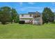 Expansive backyard with lush green lawn, mature trees, and gazebo for outdoor entertaining at 750 Raymond Dr, Clayton, NC 27527