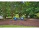 Backyard with mulch and comfortable seating, perfect for enjoying the beautifully landscaped surroundings at 750 Raymond Dr, Clayton, NC 27527